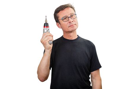 Mature man holding a screwdriver tool, isolated on a white backgroundの写真素材