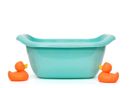 Blue plastic basin for washing small children, isolated on whiteの写真素材