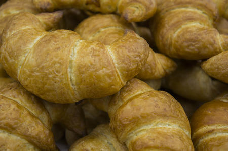 many croissants backgroundの写真素材