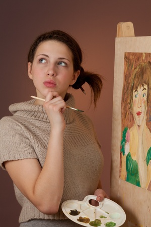 Girl painting a pictureの写真素材