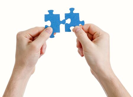 puzzle in hand isolated on white