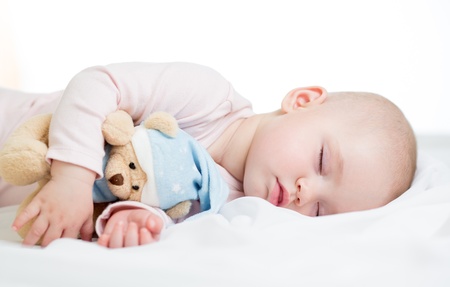 baby girl sleeping with toy