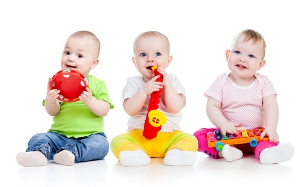 Children playing with musical toys  Isolated on white backgroundの写真素材