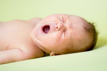 yawning newborn baby boyの写真素材