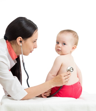 doctor examining kid girl isolated on whiteの写真素材