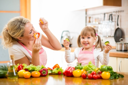 mother and kid preparing healthy foodの写真素材