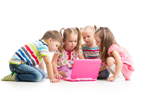 group of kids friends playing at the laptopの写真素材