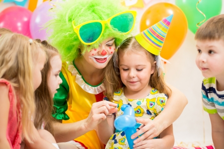 kids group and clown on birthday partyの写真素材