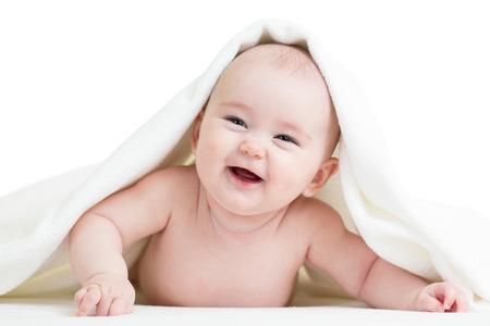 happy baby girl in towelの写真素材