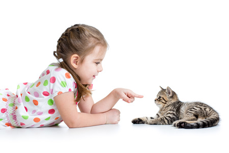cute kid lying on floor and playing with cat petの写真素材