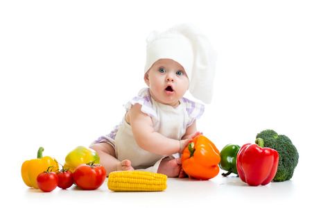 funny baby cook with healthy  food vegetablesの写真素材