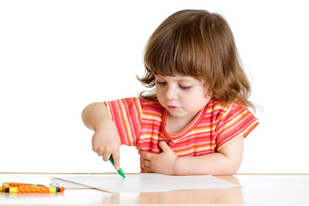 kid girl drawing with color crayonsの写真素材