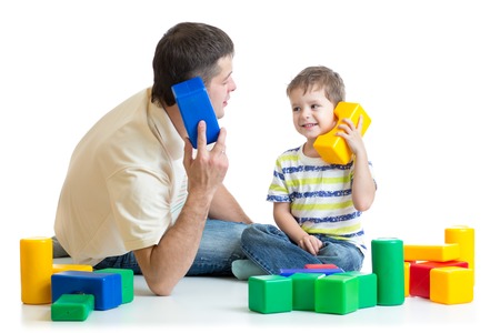 dad and child kid boy role play together isolated on whiteの写真素材