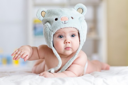 Portrait of a cute 5 months ago baby lying down on a blanketの写真素材