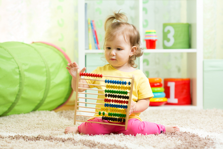 little girl playing with abacus, early learningの写真素材
