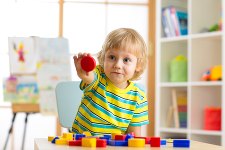 Child little boy learning shapes, early education and daycare conceptの写真素材