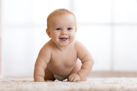 crawling funny baby boy at home