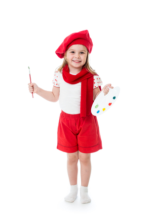 Child little girl in artist costume with paintbrush and paletteの写真素材