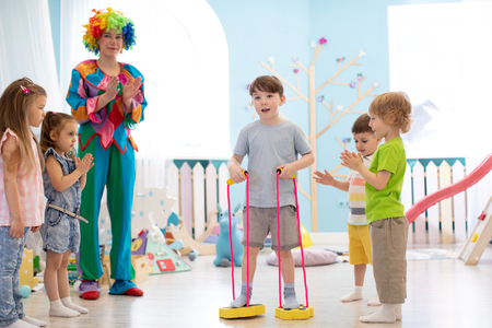 happy children and clown on birthday partyの写真素材