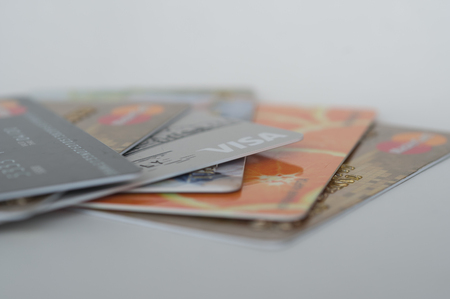 Chelyabinsk, Russia - June 21, 2016: credit cards Visa and Master Card different banks are folded like a fan on a white backgroundのeditorial素材