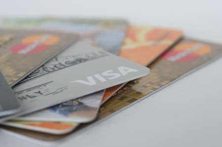 Chelyabinsk, Russia - June 21, 2016: credit cards Visa and Master Card different banks are folded like a fan on a white backgroundのeditorial素材