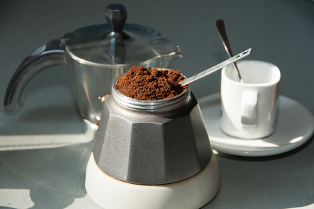 Italian coffee with ground coffee and white cupの写真素材