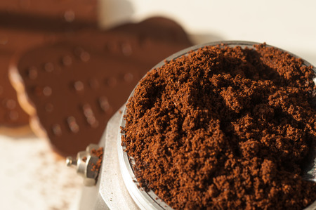 chocolate cookie and spilled coffee beansの写真素材