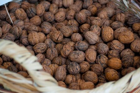 Walnuts in a wicker basket close-up