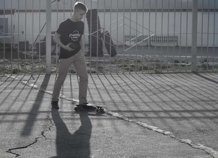 Youth rides on skateboards on a city siteのeditorial素材