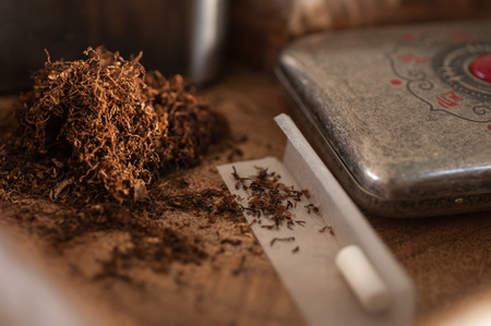 Smoking tobacco and roll-up close-upの写真素材
