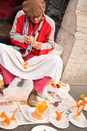 seller men crafts from vegetables on the streets of the city of Rome, Italy January 19, 2011のeditorial素材