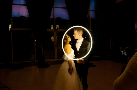 photographer takes pictures of her young couple on their wedding dayの写真素材