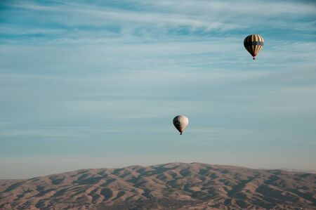 Cappadocia, Turkey November 13, 2016: Balloons with passengers in the sky early in the morning in a unique place Cappadociaのeditorial素材