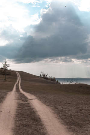 Dirt road along the shore of Lake Baikal in summerの写真素材