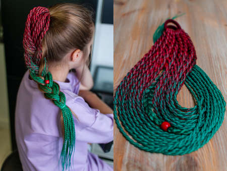 Teenage girl with long blond hair demonstrates a hair accessory, colored braids made of red-green...