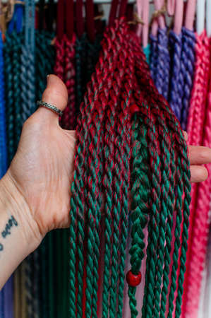 Hair accessory, colored braids of red and green artificial hair with an elastic band, hand-madeの写真素材