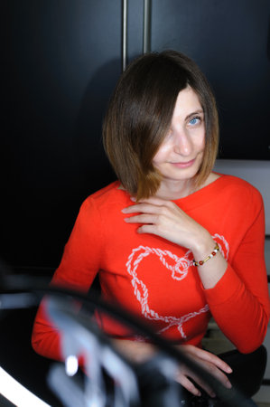 Portrait of young woman with blue eyes made indoors with ring lampの写真素材
