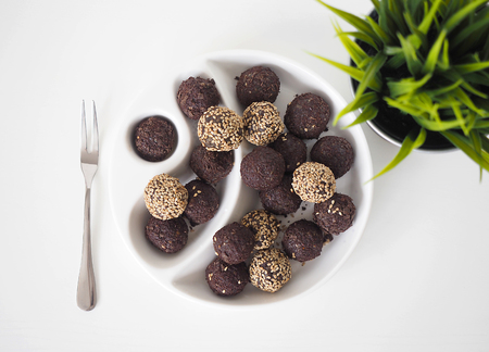 Raw vegan sweet balls with chocolate and sesameの写真素材