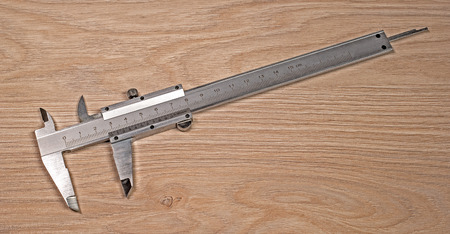 Vernier caliper on a white background. Measuring jaws divorced.の写真素材