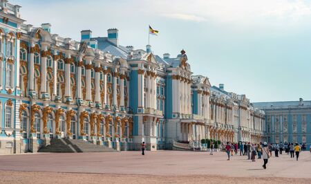 Saint-Petersburg, Russia - June 26, 2016: The main facade of the Catherine Palace in Tsarskoye Selo. Tourists sightseeing. On the roof of the royal flag is developing.のeditorial素材