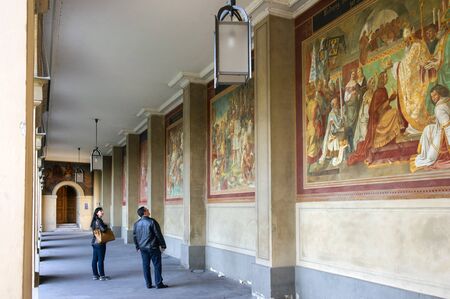 Munich, Germany - October 16, 2011: Tourists visiting the gallery in Hofgarten. Between the columns are colorful mural Peter von Cornelius, which tell about the history of the House of Wittelsbach.のeditorial素材