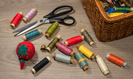 Sewing tools and accessories on wood background.の写真素材