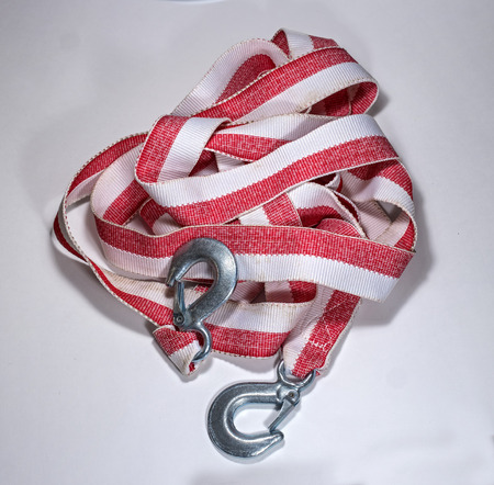 Tow rope to the car on a light background.