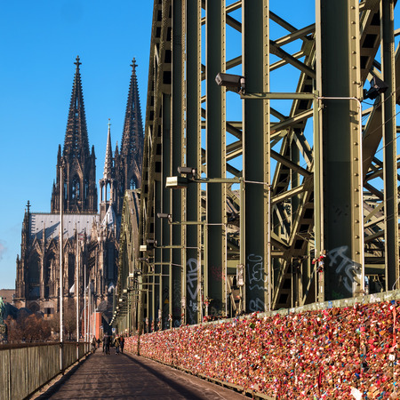 Cologne, Germany - January 19, 2017: Locks of love on the fence of the Hohenzollern Bridge. In the background is the Cathedral of Cologne.のeditorial素材