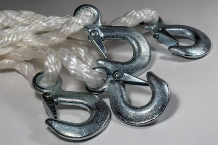 Tow hooks on a light background.