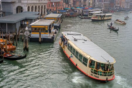 Venice, Italy - October 13, 2017: View of the Grand Canal from the Ponte di Rialto Bridge. Venice. Italy. A foggy day. The river tram is moored to the pier.のeditorial素材