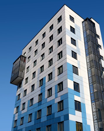 Gatchina, Russia - April 7, 2018: A modern new building against the blue sky. The building has a...