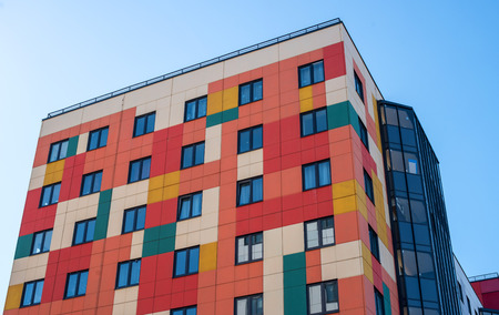 Gatchina, Russia - April 7, 2018: A modern new building. The building has a bright red-yellow color.のeditorial素材