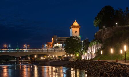 Narva, Estonia - 26 July 2018: Night panorama of the Narva castle with the tower High Herman, Narva,...