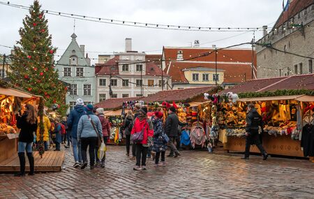 Tallinn, Estonia - January 3, 2020: Traditional christmas market in old Tallinn. Town Hall Square. A Christmas fir tree is installed on the square.のeditorial素材